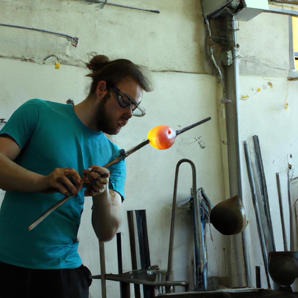 Person blowing glass in workshop