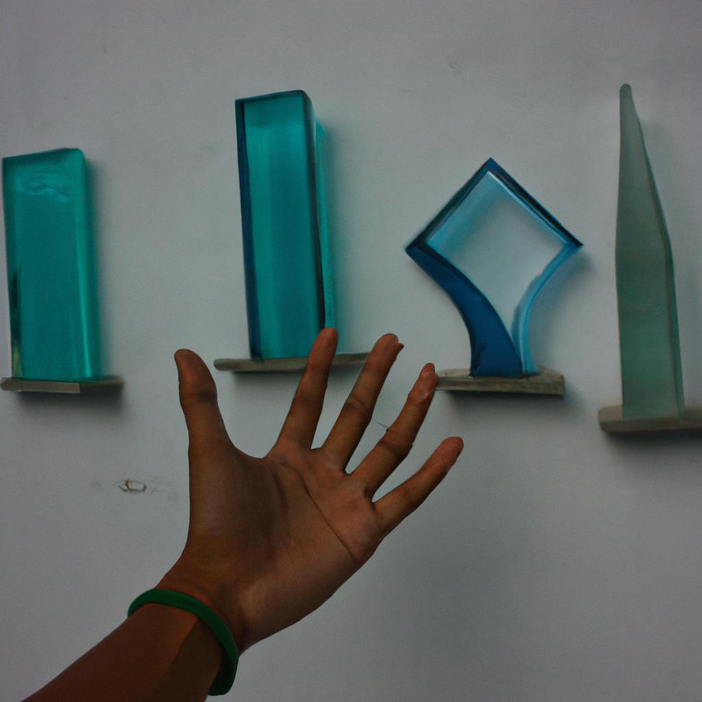 Person holding glass art exhibit
